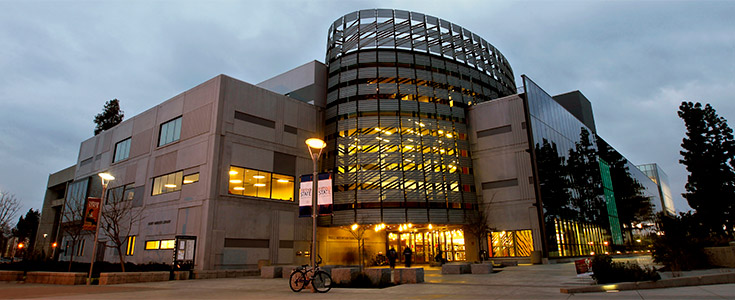 Ground level photo of the Henry Madden Library at night