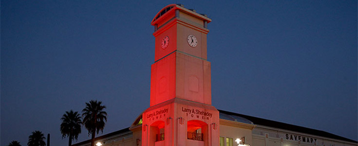 Ground view of the Larry A. Shehadey near the Save Mart Center, lit up in red